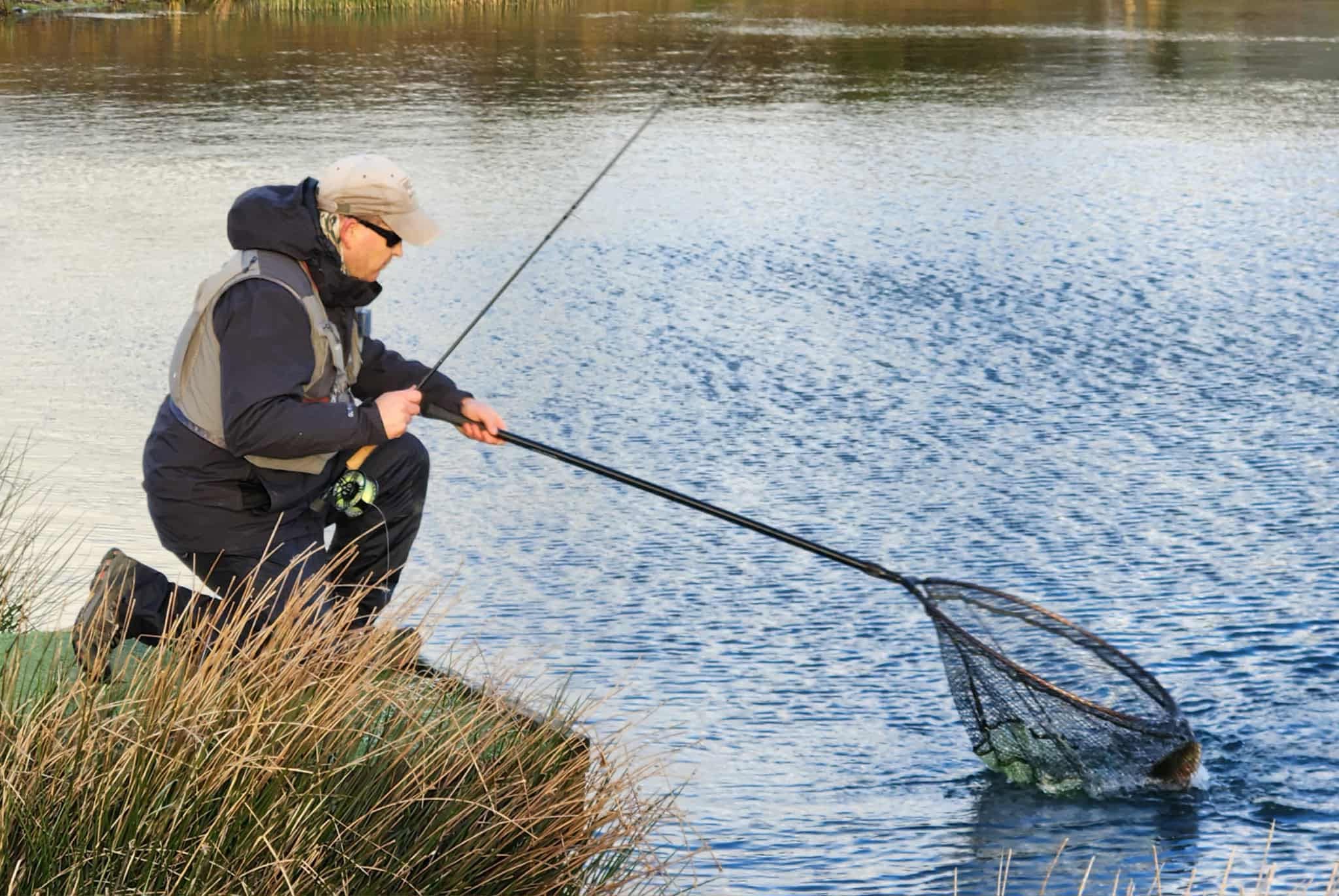 Angler fishing from the bank at Foxhill Trout Fishery
